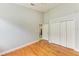 Bedroom features hardwood floors, closet space, and light gray walls at 6423 Royal Tern Cir, Lakewood Ranch, FL 34202