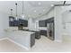 Contemporary kitchen with stainless steel appliances, granite counters, and gray cabinetry at 6423 Royal Tern Cir, Lakewood Ranch, FL 34202