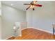 Loft area featuring hardwood floors and a ceiling fan; a cozy and versatile space for relaxation or hobbies at 6423 Royal Tern Cir, Lakewood Ranch, FL 34202