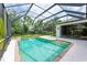 Sparkling screened-in pool with steps and surrounding patio at 6423 Royal Tern Cir, Lakewood Ranch, FL 34202