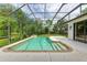 Screened-in pool area featuring a private pool, lush landscaping and mature trees at 6423 Royal Tern Cir, Lakewood Ranch, FL 34202