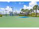 Community basketball court surrounded by palm trees for residents to get outside and stay active at 6507 Clairborne Ln, Bradenton, FL 34211