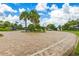 Well-maintained community entrance with brick paving, landscaping, and secure gate at 6507 Clairborne Ln, Bradenton, FL 34211