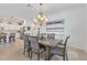 Elegant dining room featuring a chandelier, painting and easy access to the kitchen at 6507 Clairborne Ln, Bradenton, FL 34211