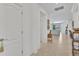 Elegant tiled foyer leading to a bright living area with neutral colors at 6507 Clairborne Ln, Bradenton, FL 34211