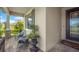 Cozy front porch with decorative potted plant and charming seating area at 6507 Clairborne Ln, Bradenton, FL 34211
