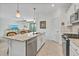Well-equipped kitchen features granite countertops and an island with stainless steel appliances at 6507 Clairborne Ln, Bradenton, FL 34211