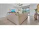 Living room with comfortable seating and sliding glass doors leading to outdoor living at 6507 Clairborne Ln, Bradenton, FL 34211