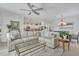 Inviting living room with an open layout and a view of the kitchen and dining areas at 6507 Clairborne Ln, Bradenton, FL 34211
