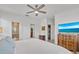 Spacious main bedroom features a ceiling fan, walk-in closet, and ensuite bathroom with tiled shower at 6507 Clairborne Ln, Bradenton, FL 34211