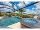Relax by the pool with a fire pit and an umbrella for shade at 6507 Clairborne Ln, Bradenton, FL 34211