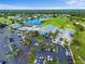 Aerial shot of community clubhouse, golf course and parking at 6507 Stone River Rd # 304, Bradenton, FL 34203