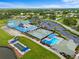Aerial view of community amenities including pool, tennis, bocce and clubhouse at 6507 Stone River Rd # 304, Bradenton, FL 34203