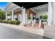 Exterior shot of clubhouse entrance with brick and white pillars at 6507 Stone River Rd # 304, Bradenton, FL 34203