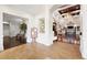 Well-appointed clubhouse lobby features tile and wood floors, and a chandelier at 6507 Stone River Rd # 304, Bradenton, FL 34203