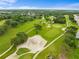 Scenic aerial view of the lush golf course with manicured fairways, sand traps, and tree-lined paths at 6507 Stone River Rd # 304, Bradenton, FL 34203