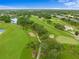 Beautiful aerial view of the golf course with mature trees and meticulously maintained greens and fairways at 6507 Stone River Rd # 304, Bradenton, FL 34203
