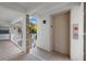 Hallway featuring neutral tile, an elevator and exterior access at 6507 Stone River Rd # 304, Bradenton, FL 34203