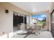Cozy screened lanai with patio furniture, offering a relaxing outdoor living space at 6507 Stone River Rd # 304, Bradenton, FL 34203