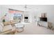 Comfortable living room featuring a balcony with a serene view at 6507 Stone River Rd # 304, Bradenton, FL 34203