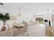 Bright living and dining area with comfortable seating and access to a balcony at 6507 Stone River Rd # 304, Bradenton, FL 34203