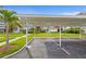 Designated covered parking area with well-maintained landscaping in a residential community at 6507 Stone River Rd # 304, Bradenton, FL 34203