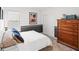 Cozy bedroom with a neutral color scheme, comfortable bed, and ample natural light at 6563 Silverstar Dr, Sarasota, FL 34240