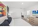 Spacious bedroom showcasing an ensuite bathroom, TV, and neutral decor with a minimalist style at 6563 Silverstar Dr, Sarasota, FL 34240
