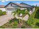 Charming single-story home with a two-car garage, manicured lawn, and inviting front entrance at 6563 Silverstar Dr, Sarasota, FL 34240