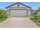 Charming home featuring a well-maintained lawn, attractive facade, and a spacious two-car garage at 6563 Silverstar Dr, Sarasota, FL 34240