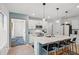 Bright kitchen with stainless steel appliances, granite countertops, and a breakfast bar with seating at 6563 Silverstar Dr, Sarasota, FL 34240