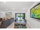 Open-concept living room and dining area, offering a spacious layout with views of the pool at 6563 Silverstar Dr, Sarasota, FL 34240