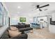 Open-concept living area with plush seating, modern decor, and abundant natural light at 6563 Silverstar Dr, Sarasota, FL 34240