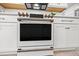 Electric range with stainless steel accents and bright lighting at 6563 Silverstar Dr, Sarasota, FL 34240