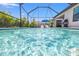 Sparkling pool offers a refreshing outdoor experience with lounge chairs and lush landscaping at 6563 Silverstar Dr, Sarasota, FL 34240