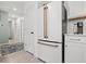 Modern kitchen featuring a stainless steel refrigerator and tile flooring at 6563 Silverstar Dr, Sarasota, FL 34240