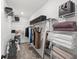 Organized walk-in closet with shelving, hanging rods, and storage solutions for clothes and accessories at 6563 Silverstar Dr, Sarasota, FL 34240