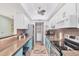 Bright kitchen with stainless steel appliances, granite countertops, and ample storage space at 6832 Woodwind Dr # 53, Sarasota, FL 34231