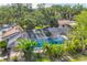 Screened in pool enclosure with tropical landscaping provides a peaceful and private backyard retreat at 6832 Woodwind Dr # 53, Sarasota, FL 34231