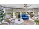 Cozy sunroom with comfortable seating, modern blinds, and abundant natural light at 6832 Woodwind Dr # 53, Sarasota, FL 34231