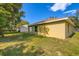 Expansive backyard with lush green grass and a view of the property at 718 17Th E St, Bradenton, FL 34208