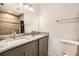 Bright bathroom features a double sink with granite counters, a toilet, and a shower at 718 17Th E St, Bradenton, FL 34208