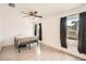 A bright bedroom features wood-look floors, a ceiling fan, and ample space at 718 17Th E St, Bradenton, FL 34208