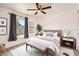 Cozy bedroom features neutral decor, stylish furniture, and a ceiling fan for added comfort at 718 17Th E St, Bradenton, FL 34208
