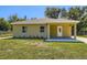 Charming single-story home with well-manicured lawn and inviting entrance at 718 17Th E St, Bradenton, FL 34208