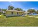 Single-story home with well-maintained lawn, and covered entryway, exuding curb appeal at 718 17Th E St, Bradenton, FL 34208