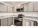 Well-equipped kitchen with stainless steel oven and granite countertops at 718 17Th E St, Bradenton, FL 34208