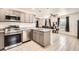 Open-concept kitchen featuring stainless steel appliances and granite countertops at 718 17Th E St, Bradenton, FL 34208