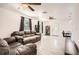 Open living room with lots of natural light, tile floors, and ceiling fans at 718 17Th E St, Bradenton, FL 34208
