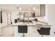 Modern kitchen with breakfast bar facing into the living room at 718 17Th E St, Bradenton, FL 34208